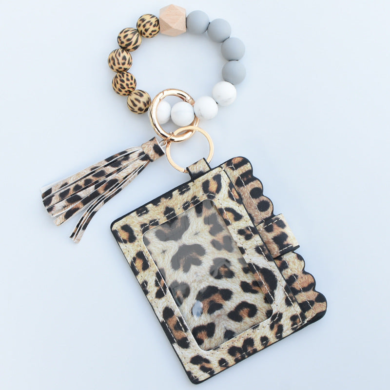 Tolchado de tarjetas de impresión de leopardo al por mayor de llavero con cuentas de silicona